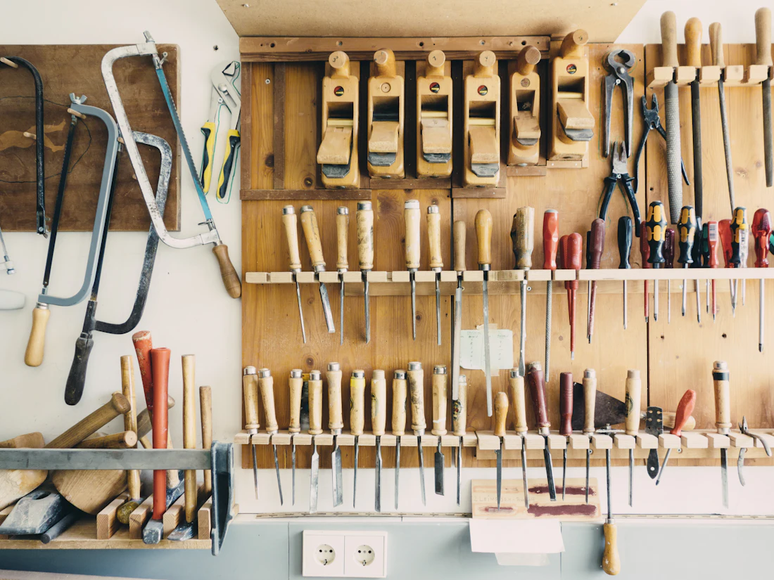 A wall of neatly organized hand tools